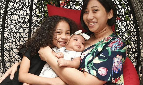 Ms Rosemary Richard Sam with her daughters Ariel, five, and two-month-old Iris. She had two miscarriages last year before conceiving her second child.ST PHOTOS KHALID BABA, DESMOND WEE