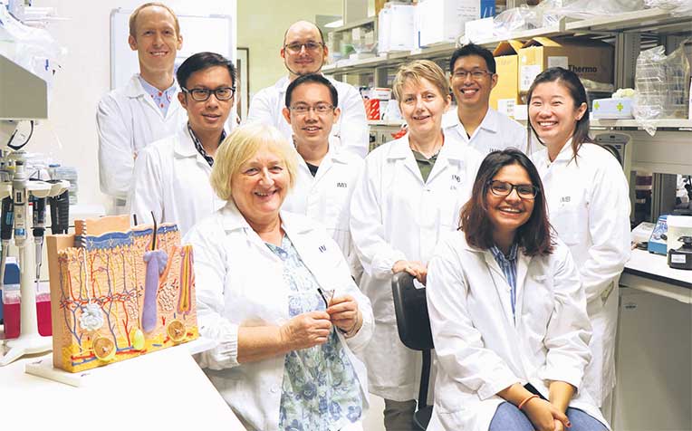 who suffers
from
epidermolysis
bullosa, with the
scientists and
researchers at
the IMB lab,
where they are
working to find
ways to treat the
rare genetic skin
blistering
condition.