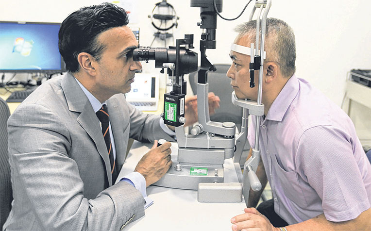 head and senior consultant at SNEC’s corneal and external eye disease department, with Mr Tan Beng Wee, who lived with pterygium for 30 years before going for Flaps last year.