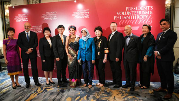  ​President Halimah Yacob poses for a photo with the winners and representatives of the winning organisations and companies of the President's Volunteerism and Philanthropy Awards 2017, on Nov 29, 2017.