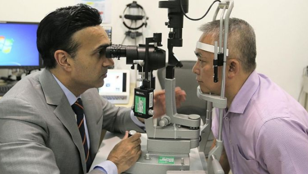 Associate Professor Jodhbir Mehta, head and senior consultant at SNEC's corneal and external eye disease department, with Mr Tan Beng Wee, who lived with pterygium for 30 years before going for Flaps last year.   ST PHOTO JONATHAN CHOO