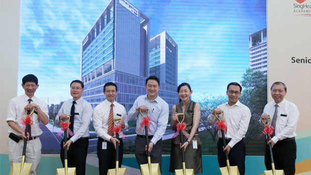  ​(From left) Professor Ang Chong Lye, Senior Adviser, SingHealth; Associate Professor Ng Wai Hoe, Medical Director, National Neuroscience Institute; Professor Kenneth Kwek, Deputy Group CEO, Organisational transformation and Informatics, SingHealth and CEO, SGH; Dr Lam Pin Min, Senior Minister of State for Health; Professor Ivy Ng, Group CEO, SingHealth; Mr Chan Heng Kee, Permanent Secretary, MOH and Professor Fong Kok Yong, Deputy Group CEO, Medical and Clinical Services, SingHealth and Chairman, Medical Board, SGH, at the Emergency Medicine Building ground-breaking ceremony on April 3, 2018.  ST PHOTO JONATHAN CHOO
