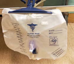 change urine bag - ensure urine is empty